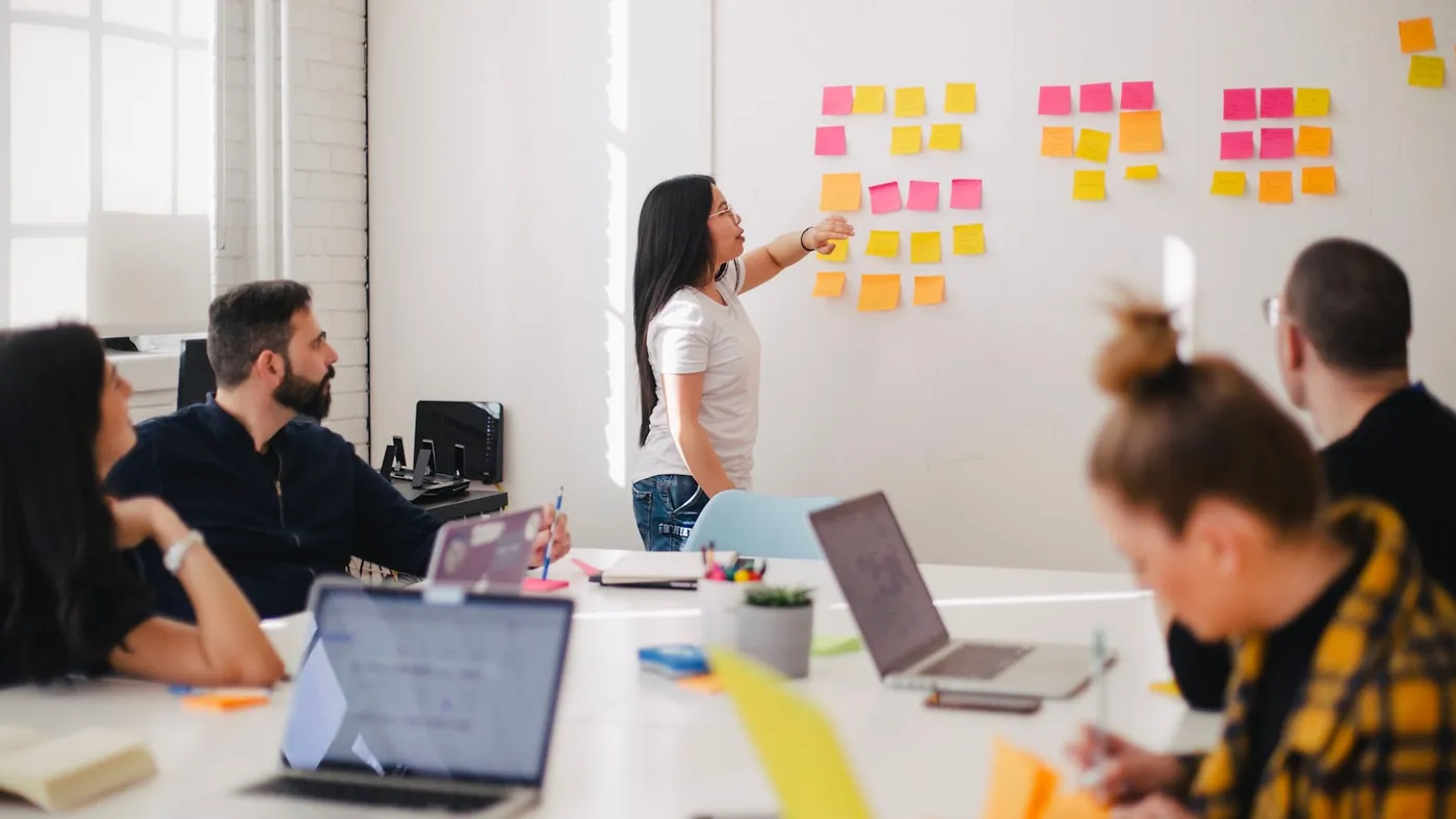 Business owners comparing web design agency options in a meeting