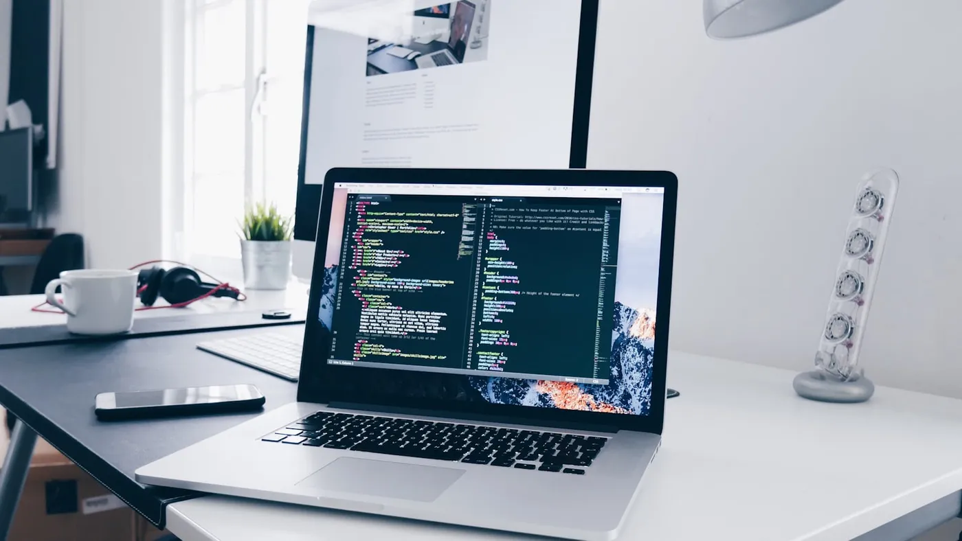 Developer workstation showing a small business site being improved for SEO