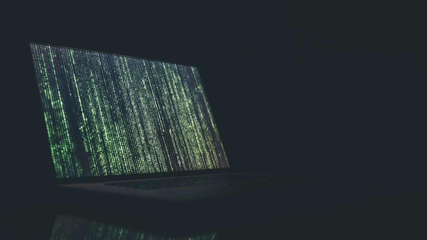 Notebook and laptop used to review website SEO problems before launch